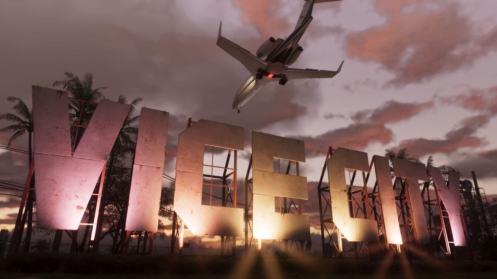 Der Vice-City-Schriftzug leuchtet bei Sonnenuntergang, während ein Jet darüber hinwegfliegt