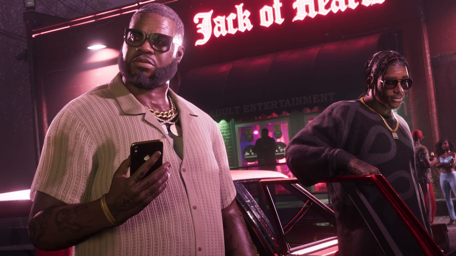 Boobie Ike, phone in hand, and Dre’Quan Priest getting out of a car outside the Jack of Hearts